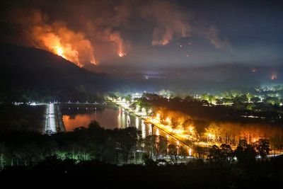 Thai authorities battle spread of mountain wildfires