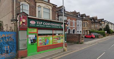 Corner shop worker battered with pole by robber