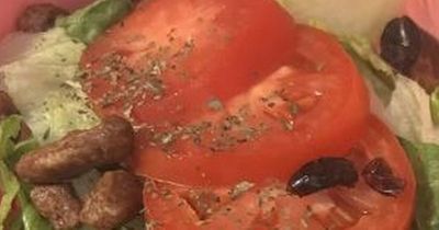 Woman's work lunch slated as she slaps unusual fruit on top of hummus