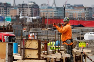 US revises down last quarter's economic growth to 2.6% rate