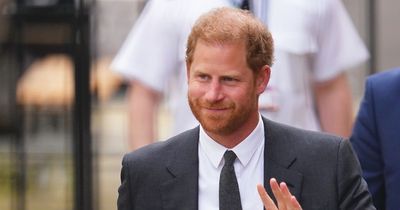 Prince Harry smiles and waves as he arrives at court for final day of legal hearing