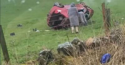 Aftermath of Scottish crash shows car flipped onto roof in field as driver flees