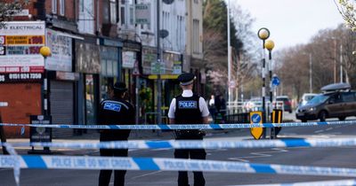 Man stabbed in daylight robbery as police seal off major road