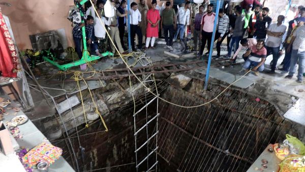 Thirty-five bodies found inside well after collapse at Indian temple