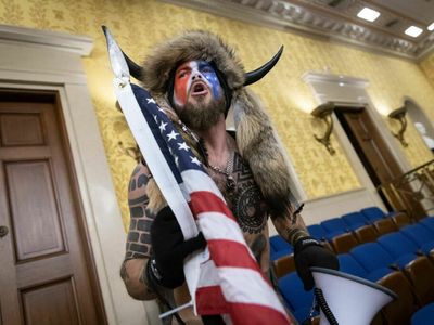 U.S. Capitol rioter the 'QAnon Shaman' is released early from federal prison