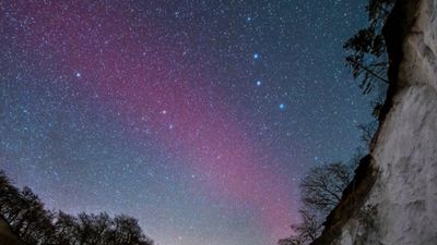 Rare blood-red arc of light shines in the Scandinavian sky. What is it?