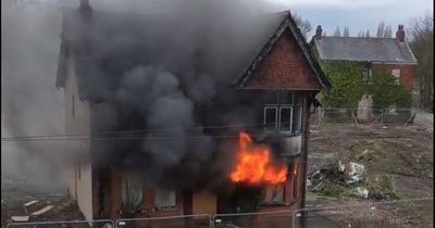 Smoke and flames billow from derelict building as fire rips through it