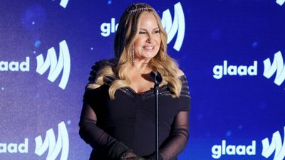 Jennifer Coolidge amps up Old Hollywood glamour with crystal headpiece as she delivers a typically memorable speech