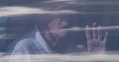 Donald Trump waves from limo as he prepares for court hearing on porn star payments