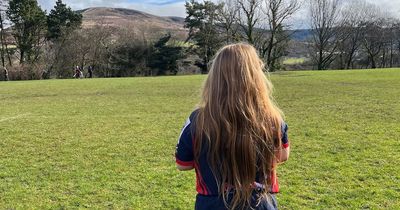 Young rugby prop grows 24in hair after not having it cut for three years