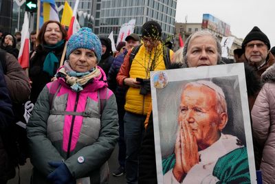 Poland marches defend John Paul II from abuse cover-up claim