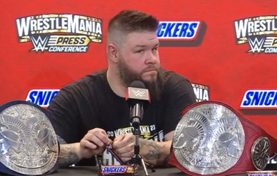 Kevin Owens was the opposite of subtle trying to sneakily eat a Snickers after his tag-team win