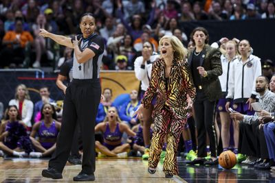 LSU coach Kim Mulkey stood on the court constantly during the title game, frustrating fans