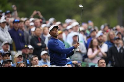 11 photos of Tiger Woods practicing Monday at Augusta before the Masters in front of a huge crowd