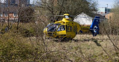 Air ambulance lands as man rushed to hospital with burn injuries after being rescued from flat fire