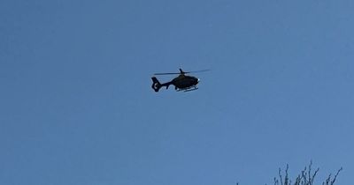 Police helicopter scrambled to area after vehicle shot in 'dispute' as gunman remains at large