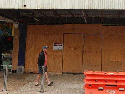 Premier tours flood-hit region on slow road to recovery