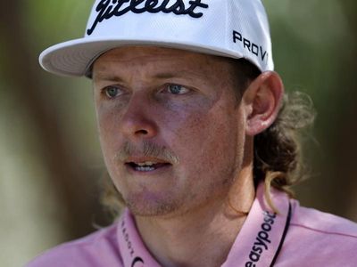 LIV Golf leader Cameron Smith embraced at Masters