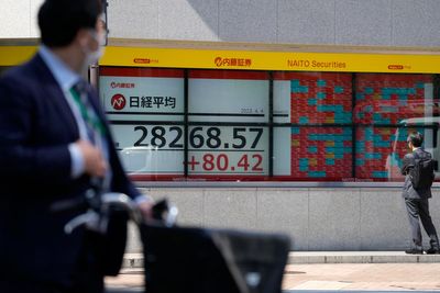 Asian shares mixed as surging oil prices fan inflation fears