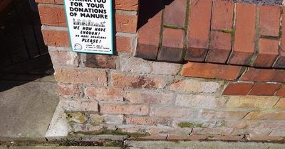 Furious homeowner installs sign outside her house in warning against 'manure donations'