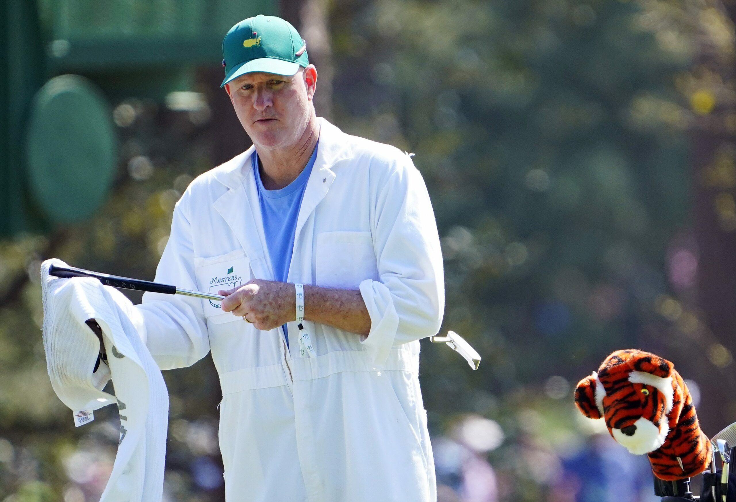 Why Masters caddies wear the same white uniforms at…
