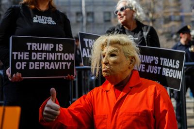 The wildest signs from outside Trump’s arraignment