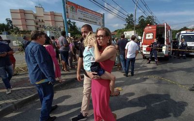 Axe-wielding man scales wall in kindergarten massacre