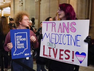 The governors from Indiana and Idaho sign bans on gender-affirming care