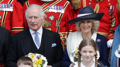 Queen Camilla ups the glamour with enviable Chanel handbag and regal white pashmina for York trip