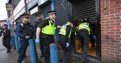 'This is the end of Counterfeit Street': Police seize huge haul of fake goods after storming shops on notorious street