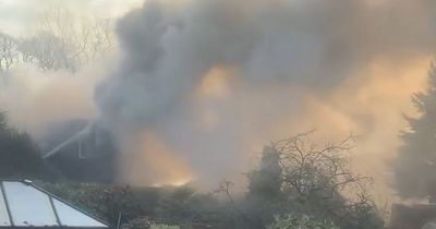 Thick black smoke pours over gardens as fire breaks out at derelict church