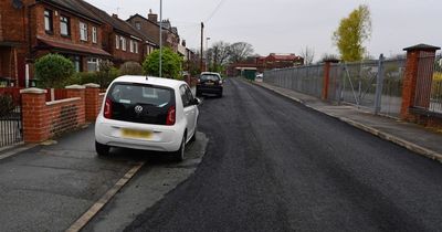 Cheeky council road workers tarmac AROUND a parked car 'that wouldn't move'
