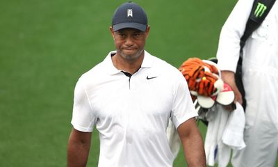 Woods offers glimpses of old razzle-dazzle but faces battle to make cut