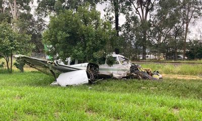 Pilot walks away from light plane crash near train tracks in Queensland