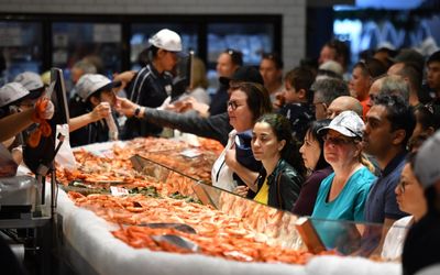Inflation crimps Australians’ appetite for Easter travel but not our taste for seafood