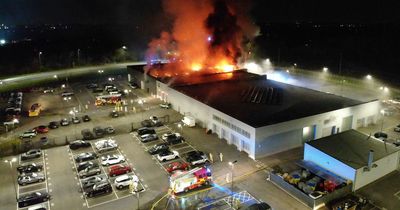 Huge flames billow from Jaguar Land Rover dealership after fire breaks out