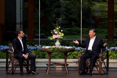 With lavish treatment of Macron, China's Xi woos France to "counter" U.S.