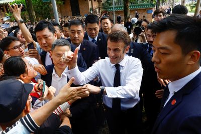 At elite Chinese university, Macron hails 'critical thinking'