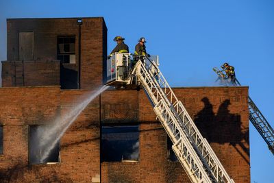 Fire official: 11 hurt in Detroit apartment building fire