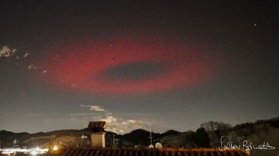 Eerie ring of red light flashes like a massive UFO above Italy. What was it?