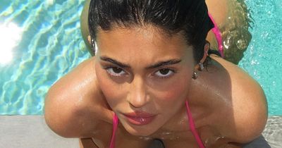 Kylie Jenner shows off her curves in pink 'Barbie' bikini in sultry pool snaps