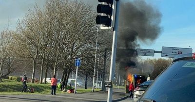 Patient and staff escape burning ambulance as smoke billows into sky