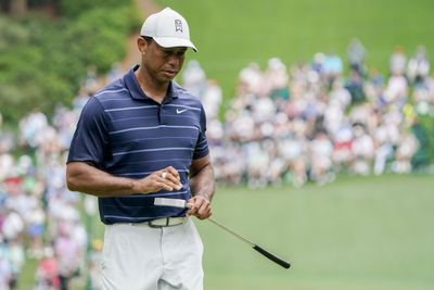 Tiger Woods will have to wait for his latest attempt at Masters history after weather delay at Augusta National