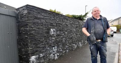 Furious man who built 6ft wall outside his home for 'privacy' ordered to remove it
