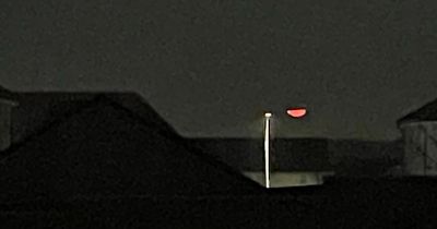 Astonished woman catches moment UFO flies over Edinburgh landmark