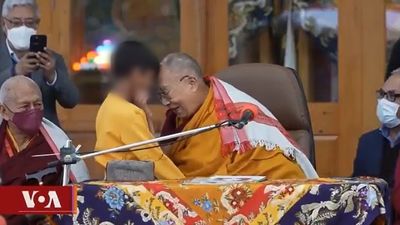 Dalai Lama apologises after video circulates online of Tibetan spiritual leader kissing a young boy and asking him to 'suck my tongue'