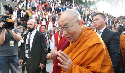 Dalai Lama apologises after video asking boy to 'suck my tongue'