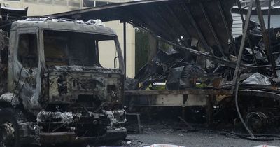 Charred and tattered remains of HGVs at industrial estate after arson attack
