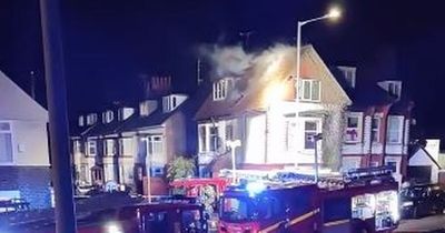 Windows smashed and person in hospital after fire rips through home