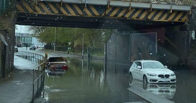 More cars left submerged as heavy rain causes road beneath bridge in Levenshulme to flood AGAIN